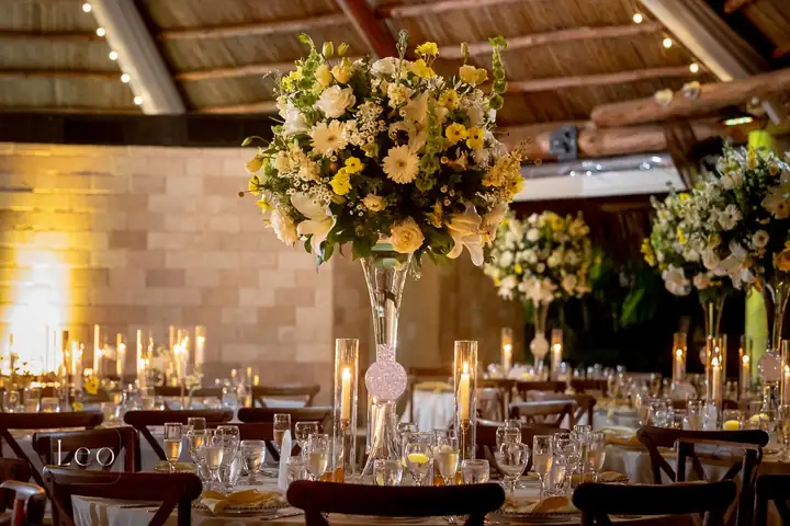 Warm candlelit reception tables at Longan’s Place