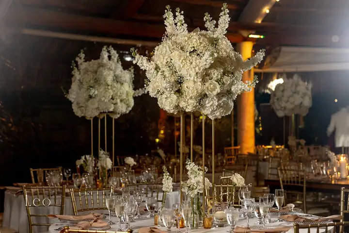 Elegant reception table with tall floral arrangements