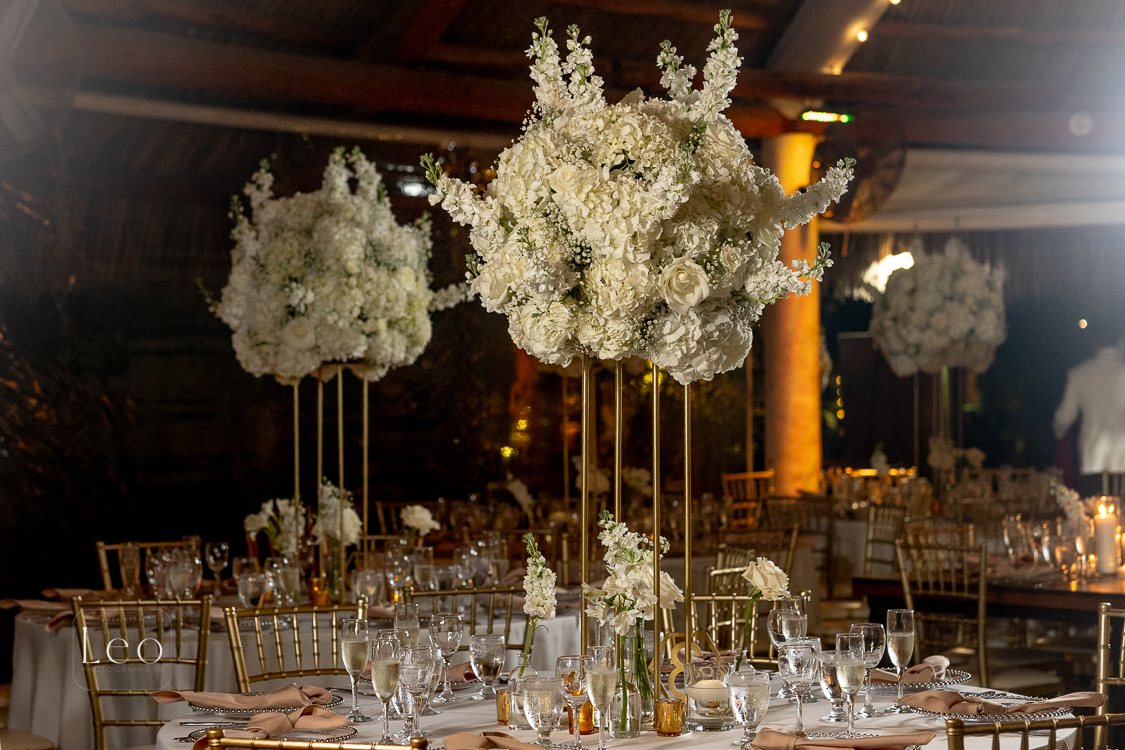 Elegant reception table with tall floral arrangements