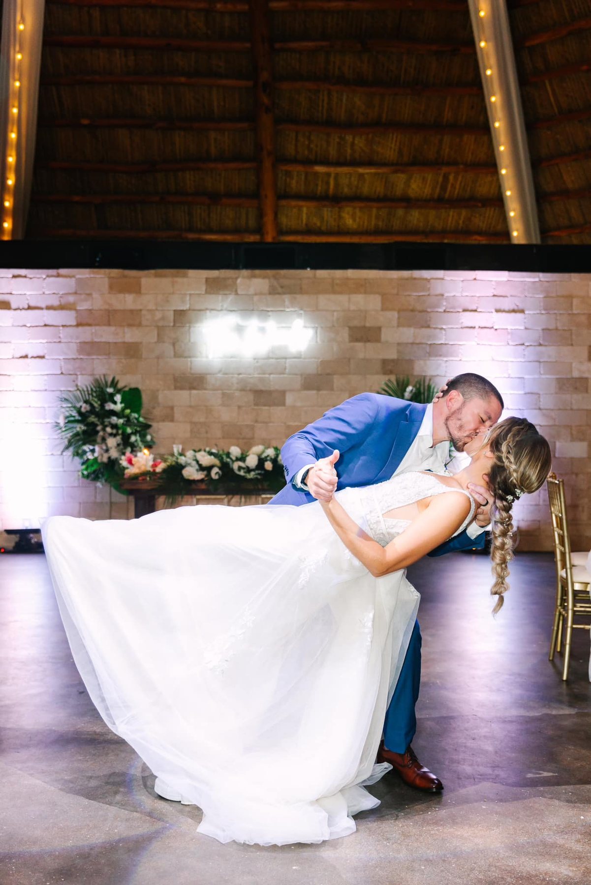 Newlyweds dancing in the reception space at Longan’s Place