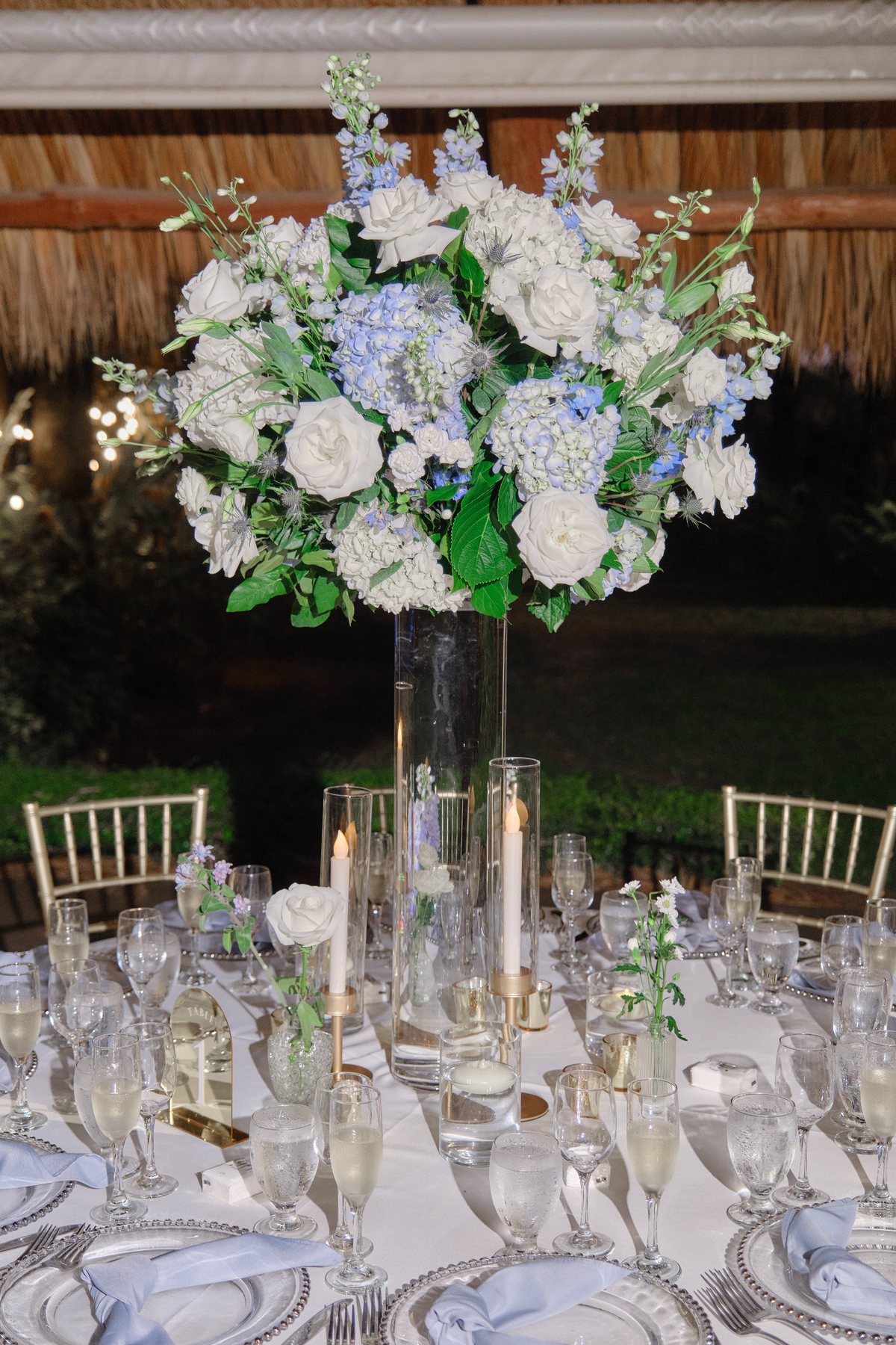 Tall floral centerpiece on reception table