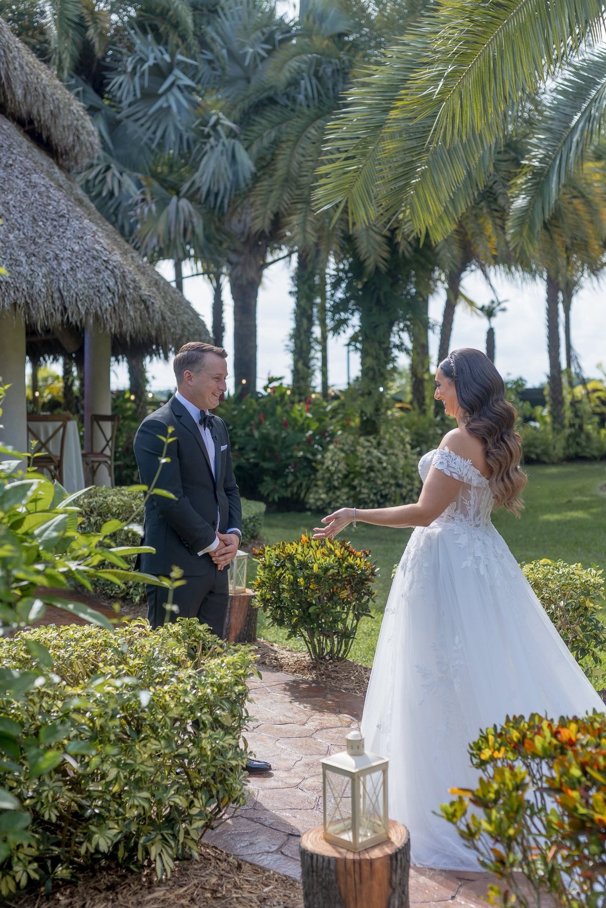 Bride and groom walking through the garden