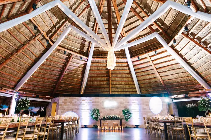 Open-air reception space with chandeliers