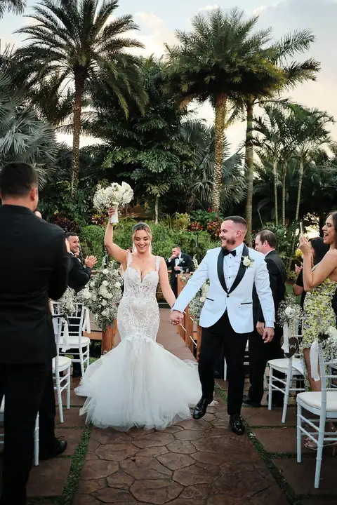 Bride and groom walking the ceremony aisle
