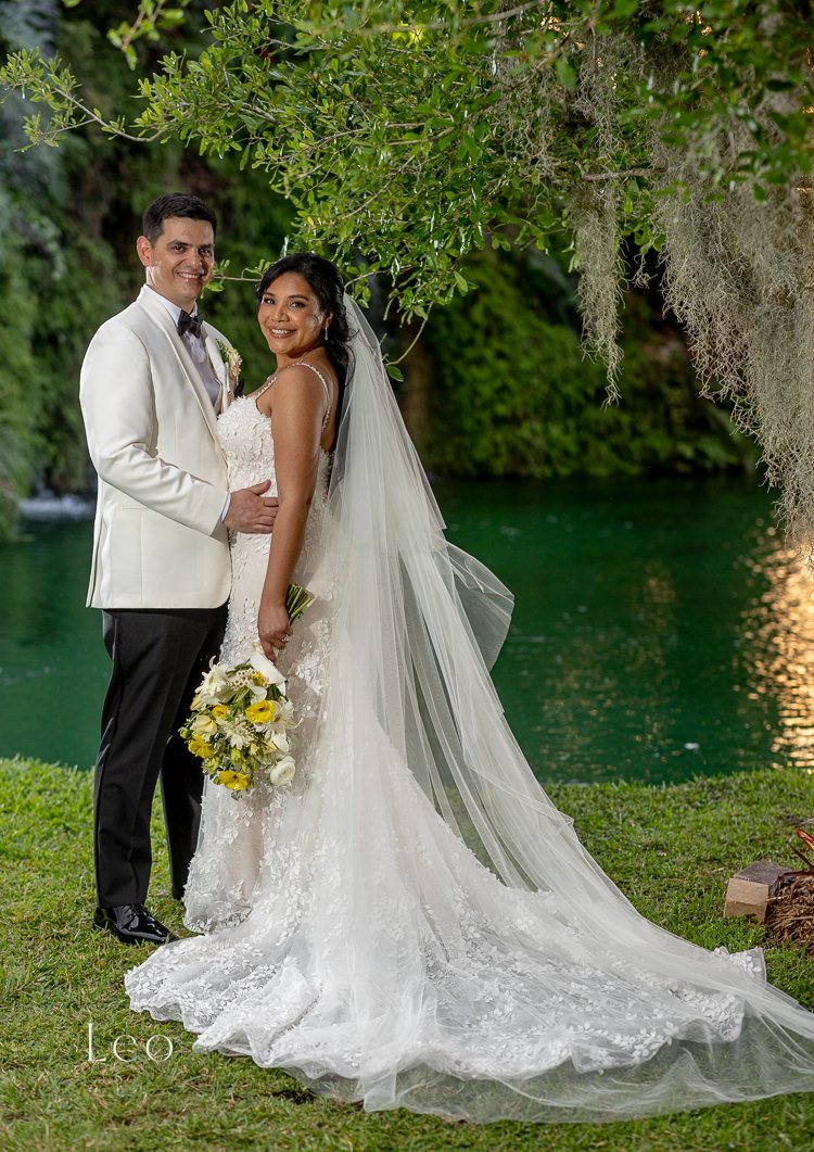 Bride and groom portrait in the greenery